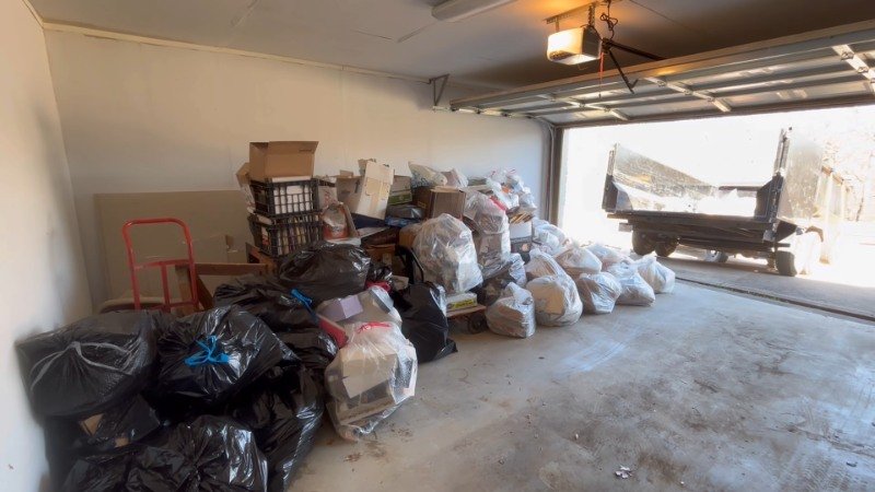Garage cleanout service in Chicago with items loaded from inside a garage